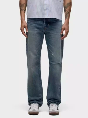 A medium-dark indigo wash denim jeans A medium dark indigo wash denim jeans