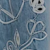 Embroidery on denim jeans