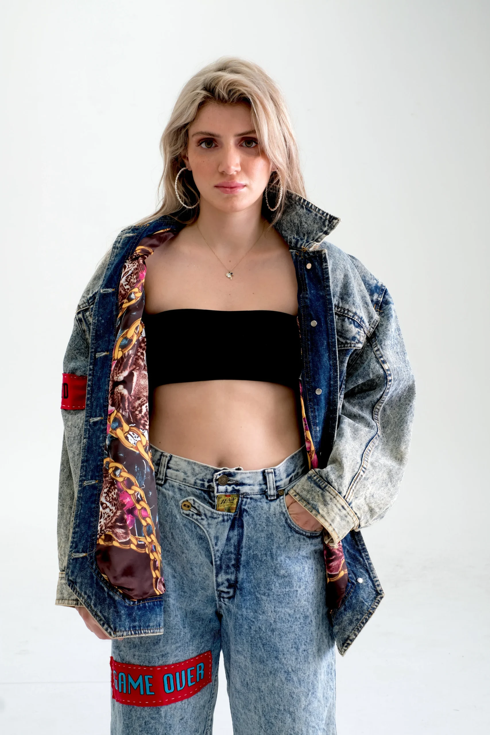 Bleach washed Long Line vintage jacket. We customised this piece by sewing in our bespoke lining and embroidered band in red on the arm with our moto embroidered in ‘I am who i am. Your Approval is not needed.’ The back is hand painted as the 3rd im…