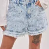 Denim shorts with rhinestone fringe