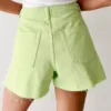 Low rise distressed denim shorts